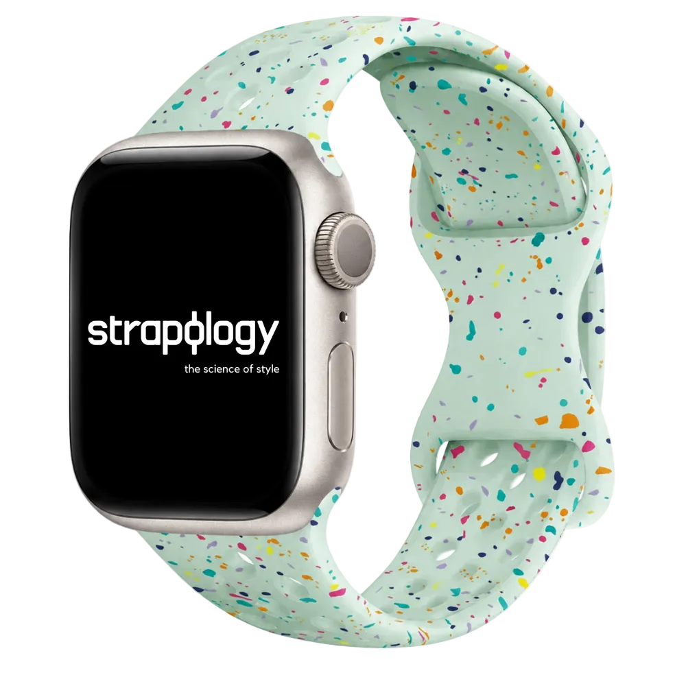 Smartwatch with a colorful speckled band on a white background, featuring the brand 'Straplogy'.